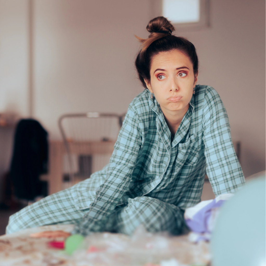 overwhelmed mom lacking capacity in the chaos of home, still in pajamas and trying to find energy to get started