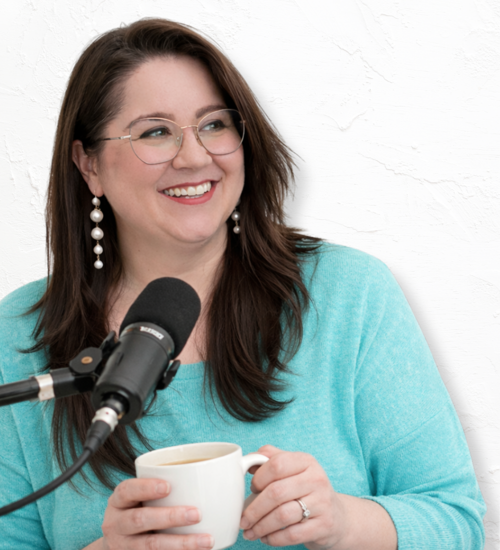 lisa yvonne podcasting, holding coffee and smiling