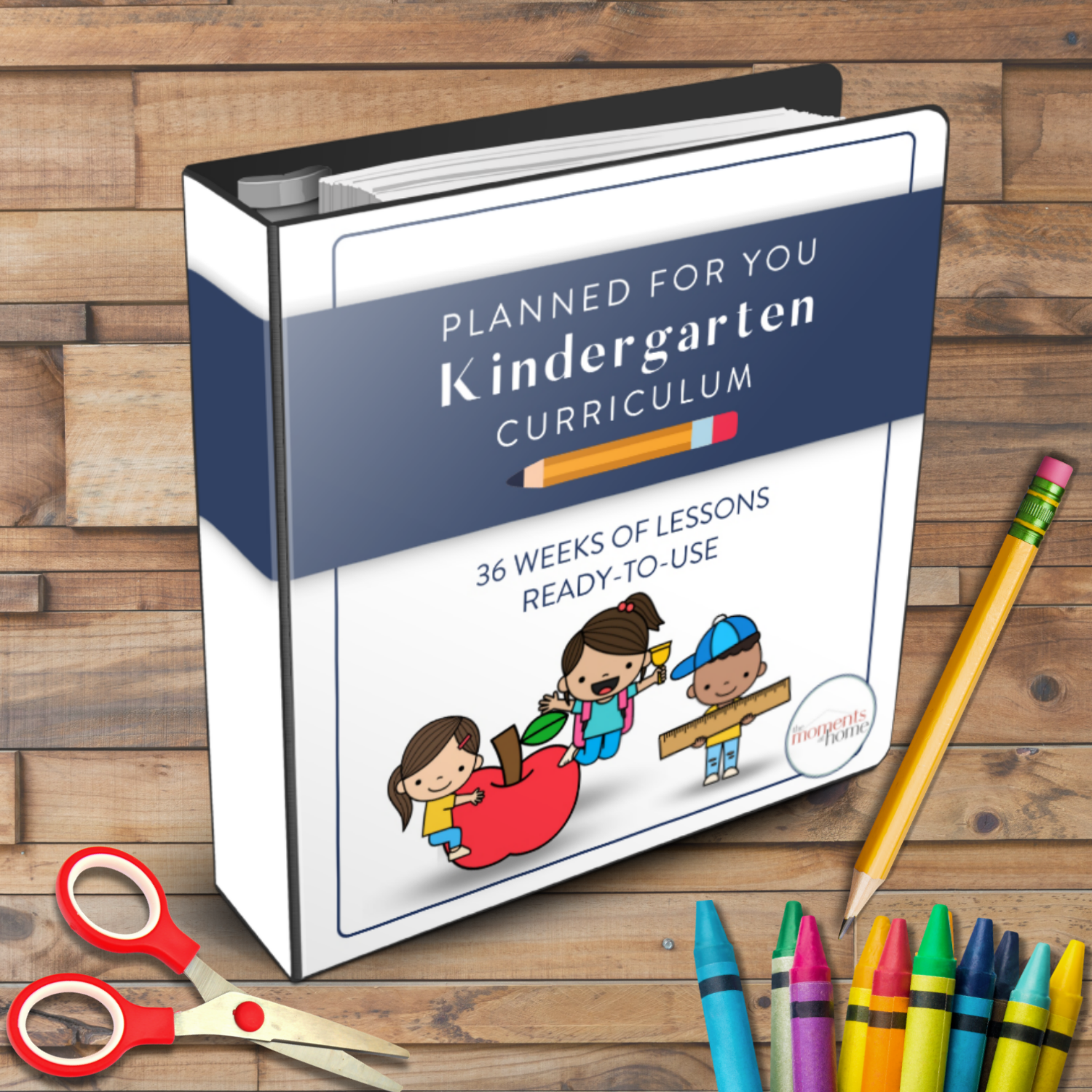 mockup of the moments at home kindergarten curriculum on a wooden background with school supplies on it